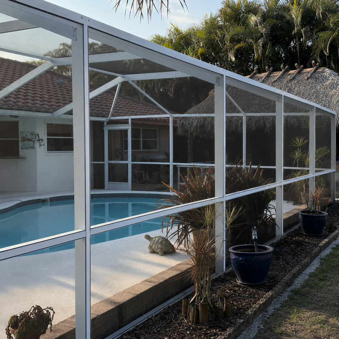 Pool screen enclosure with bright white frames and clear screens after washing