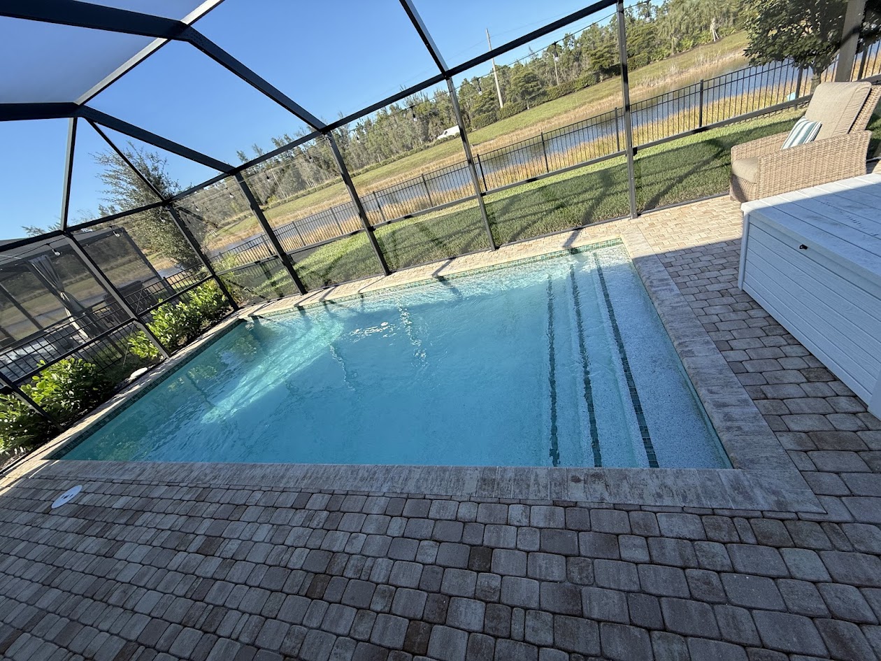 Pristine pool deck and clear water - Premier pool maintenance