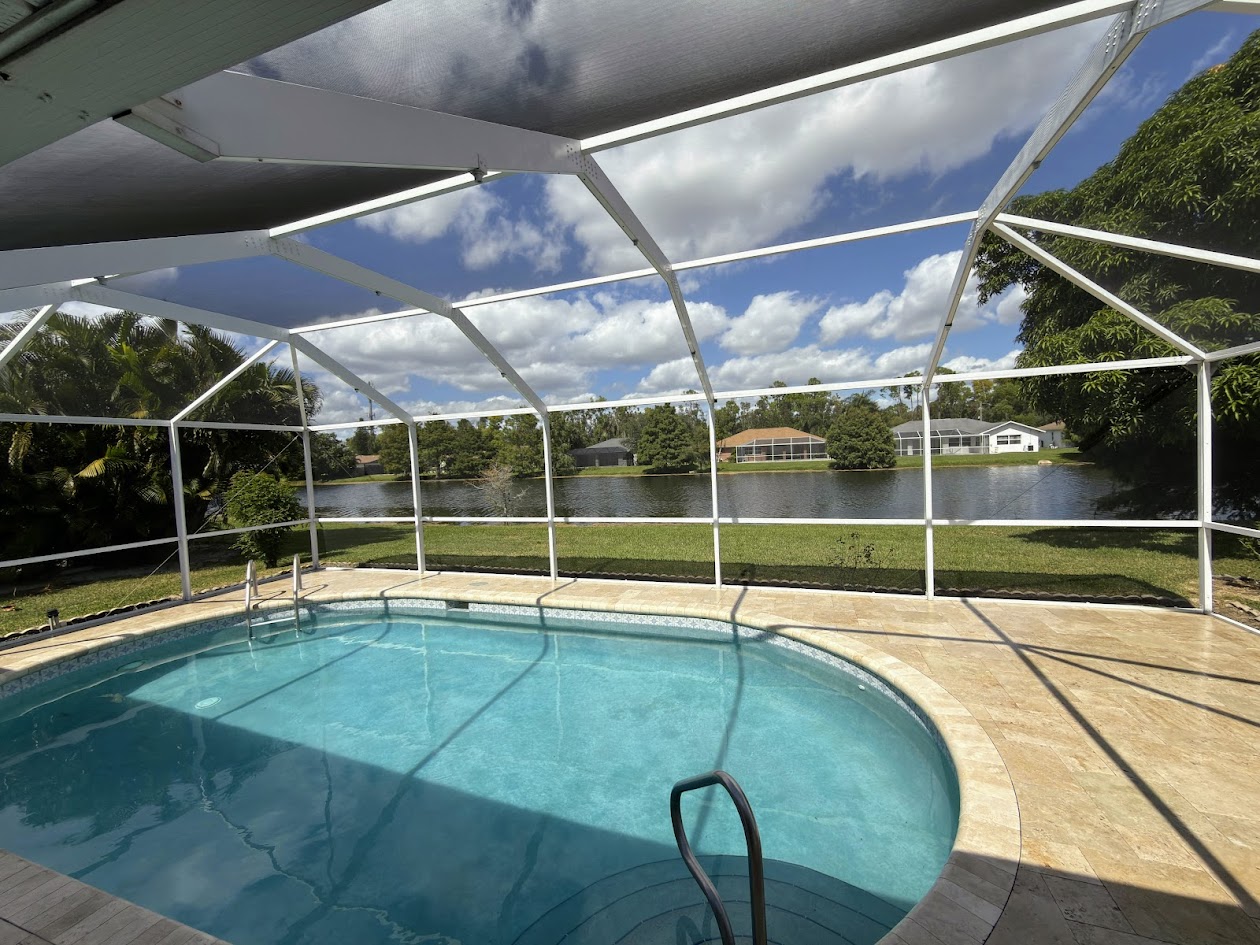 Well-maintained pool with blue water and clean tile line