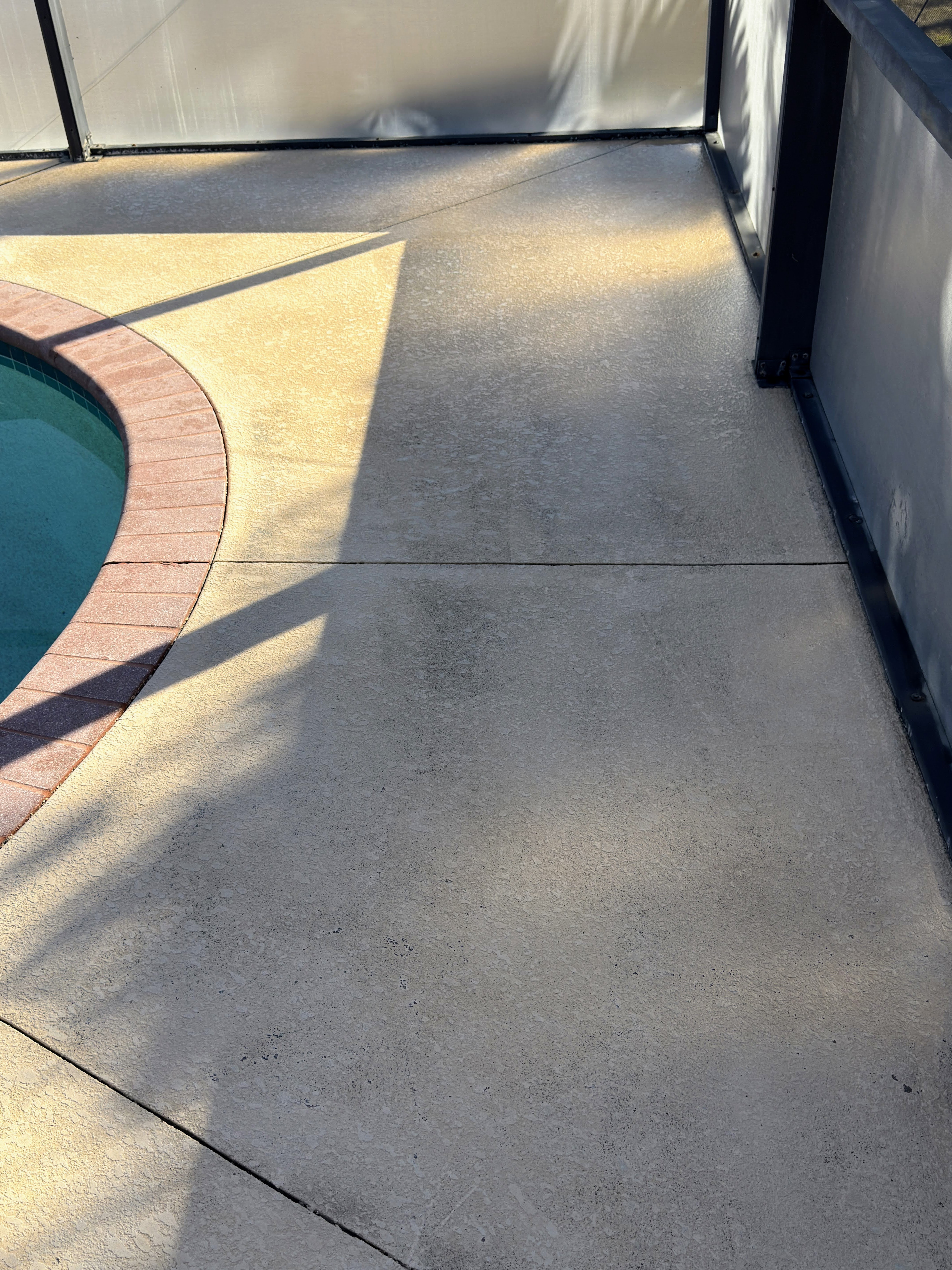 Pool deck after pressure washing - bright white and clean, Cape Coral FL