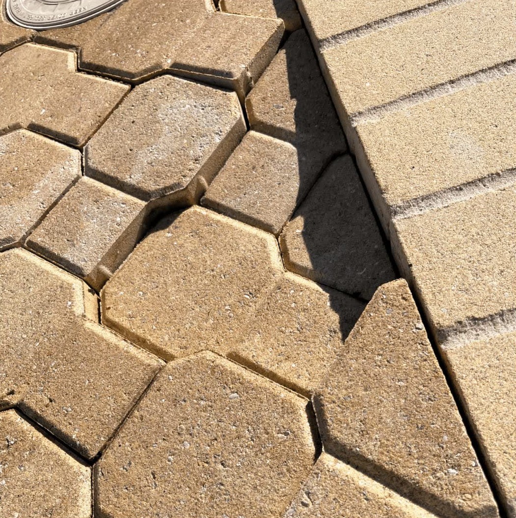 Re-leveled paver surface